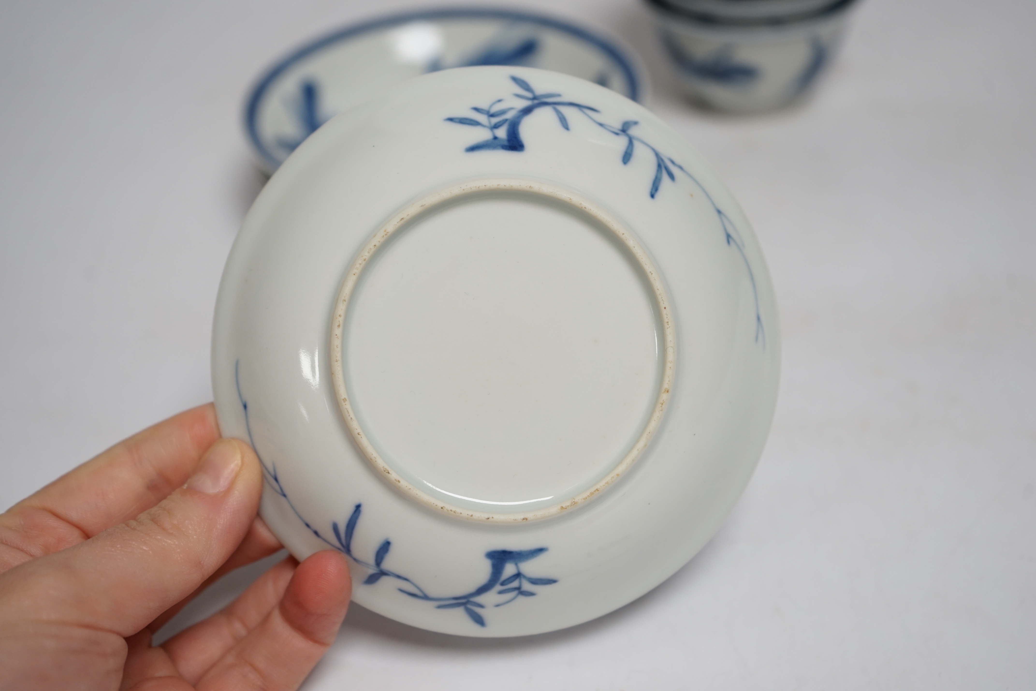 A set of four Chinese blue and white teabowls and saucers